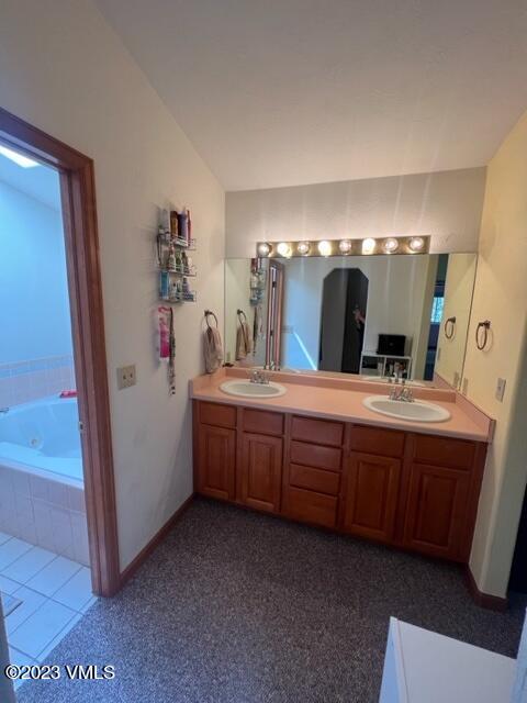 6 Ringneck Eagle, CO 81631 - Photo 29 of 50 a bathroom with a double vanity sink and mirror