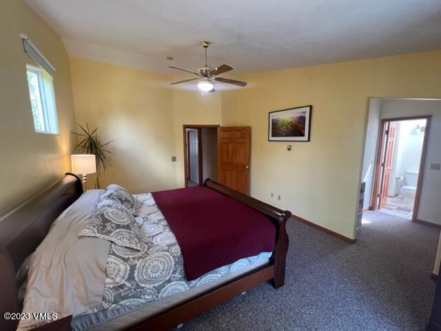 6 Ringneck Eagle, CO 81631 - Photo 32 of 50 a bedroom with a bed and a chandelier