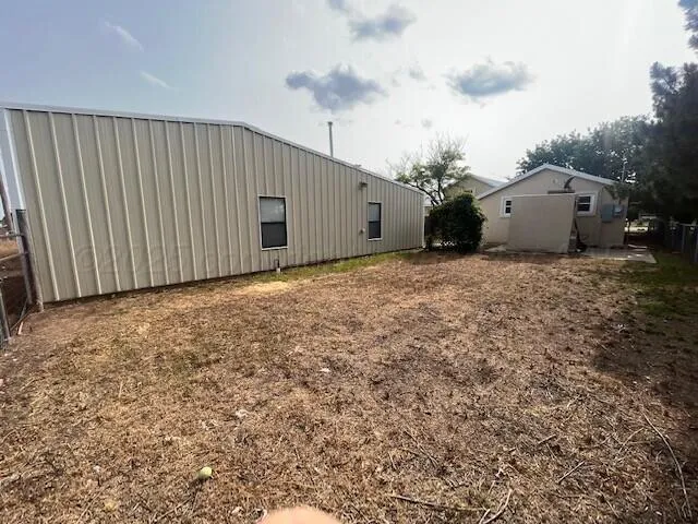 a view of a back yard of the house