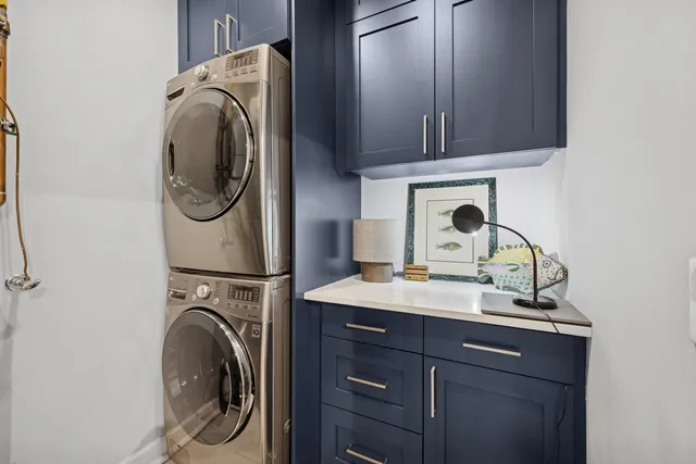 a utility room with sink dryer and washer