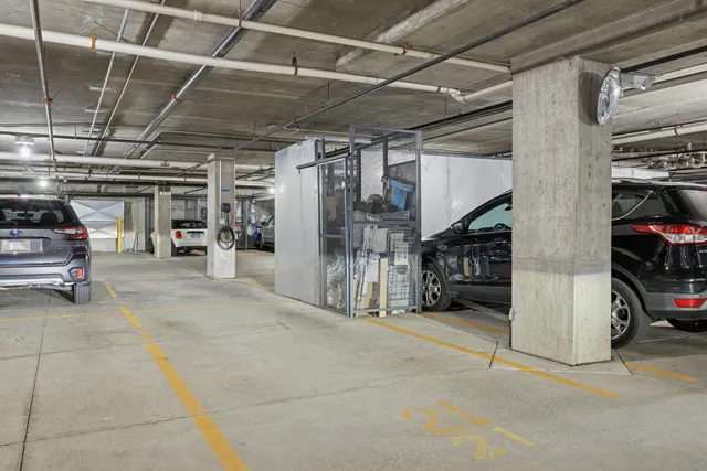 a view of parking garage with cars