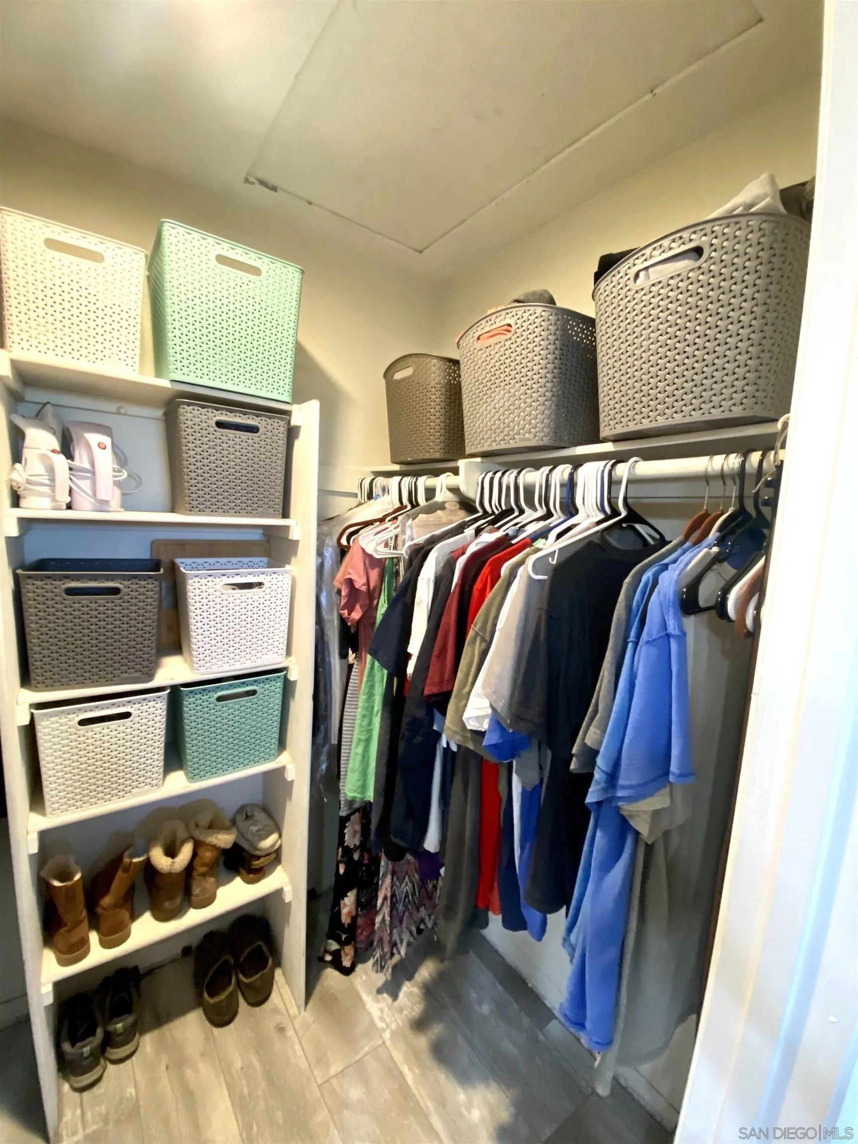 8834 Tamberly Lane, Unit D Santee, CA 92071 - Photo 26 of 28 a view of walk in closet with clothes and shoes