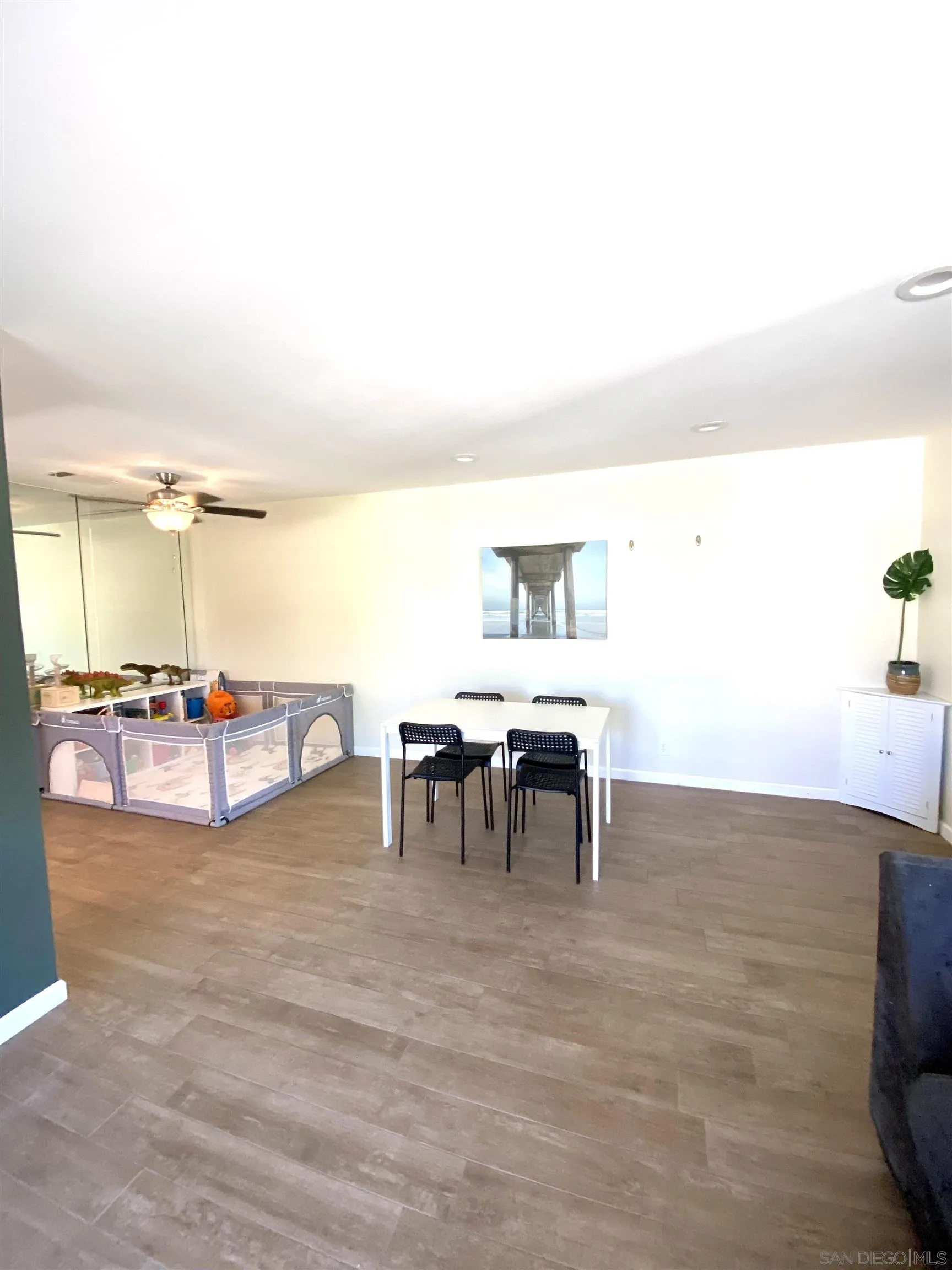 8834 Tamberly Lane, Unit D Santee, CA 92071 - Photo 5 of 28 a view of dining room with furniture and floor to ceiling window