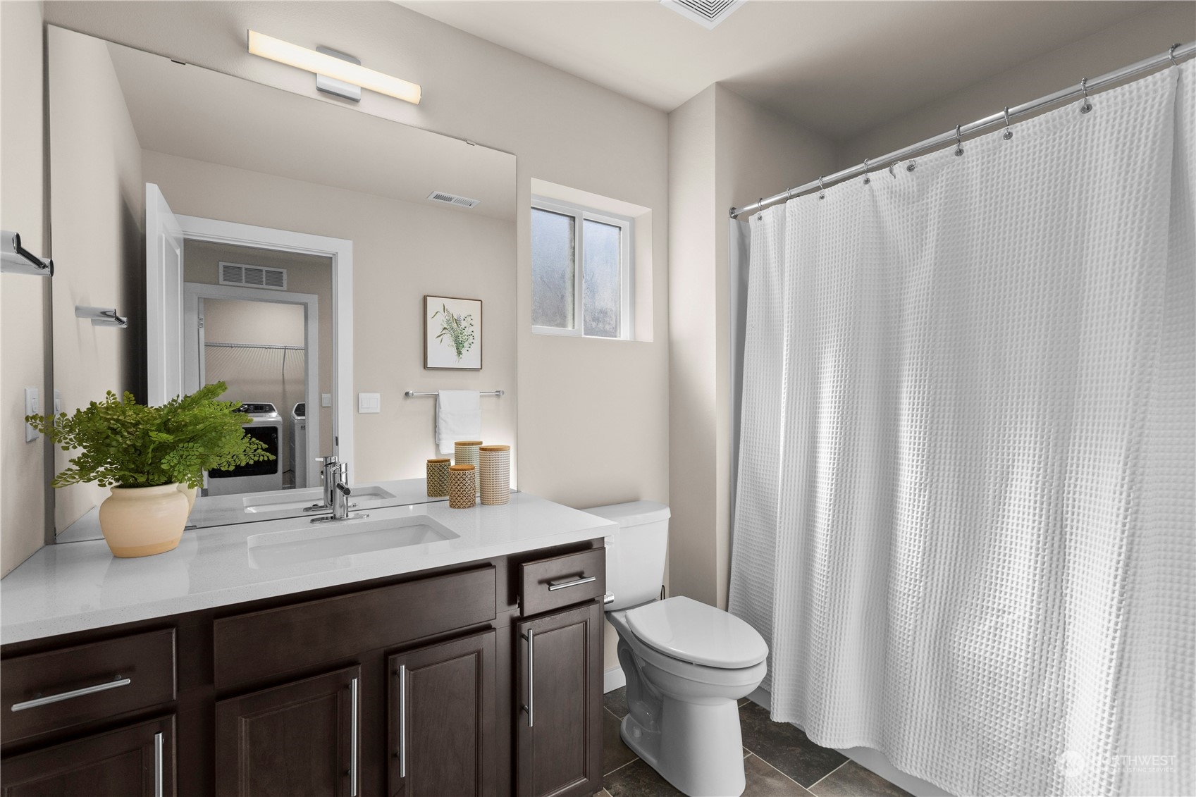 20803 3rd Drive Southeast Bothell, WA 98012 - Photo 26 of 30 a bathroom with a granite countertop sink toilet and a mirror