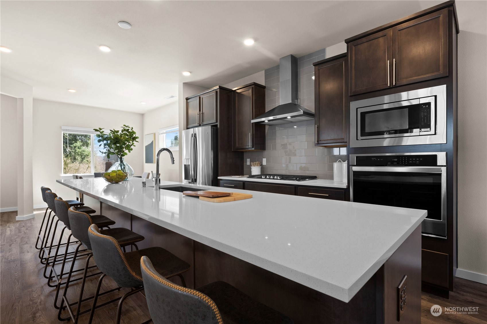 20803 3rd Drive Southeast Bothell, WA 98012 - Photo 5 of 30 a kitchen with stainless steel appliances a sink table and chairs