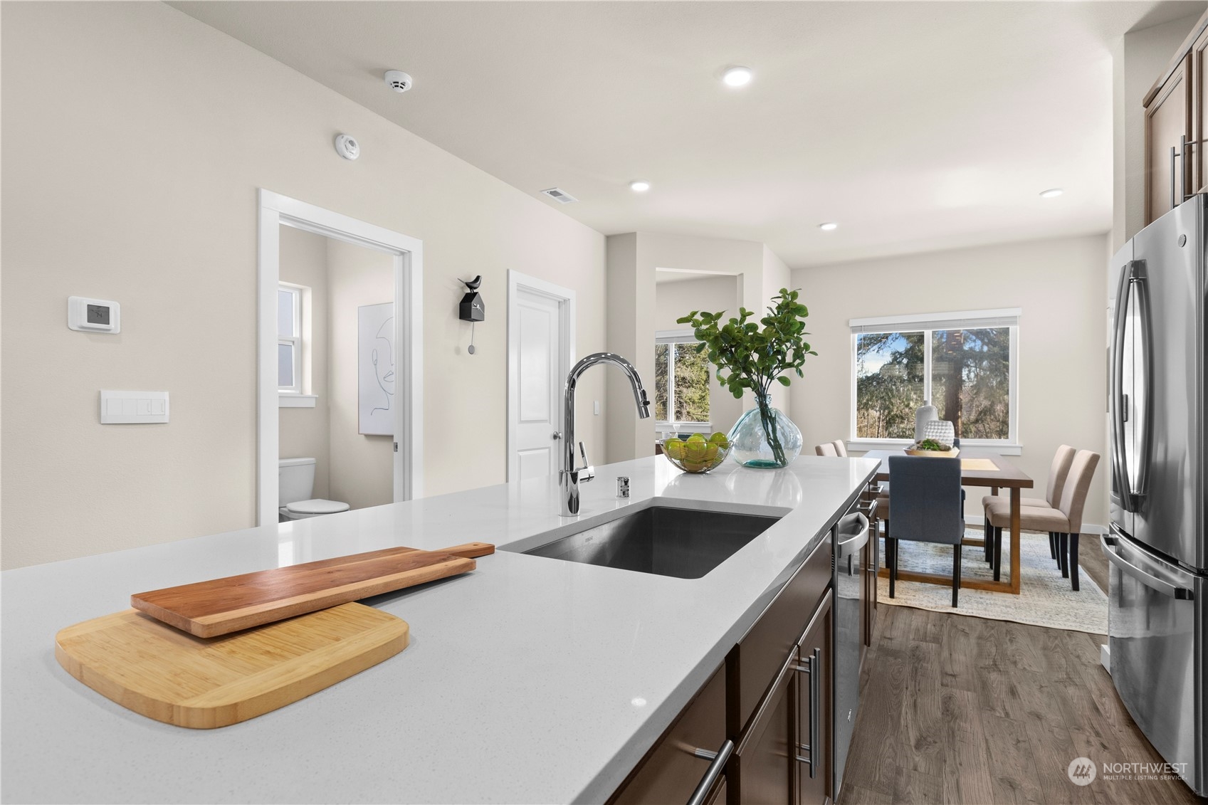 20803 3rd Drive Southeast Bothell, WA 98012 - Photo 8 of 30 a kitchen with a table chairs and refrigerator