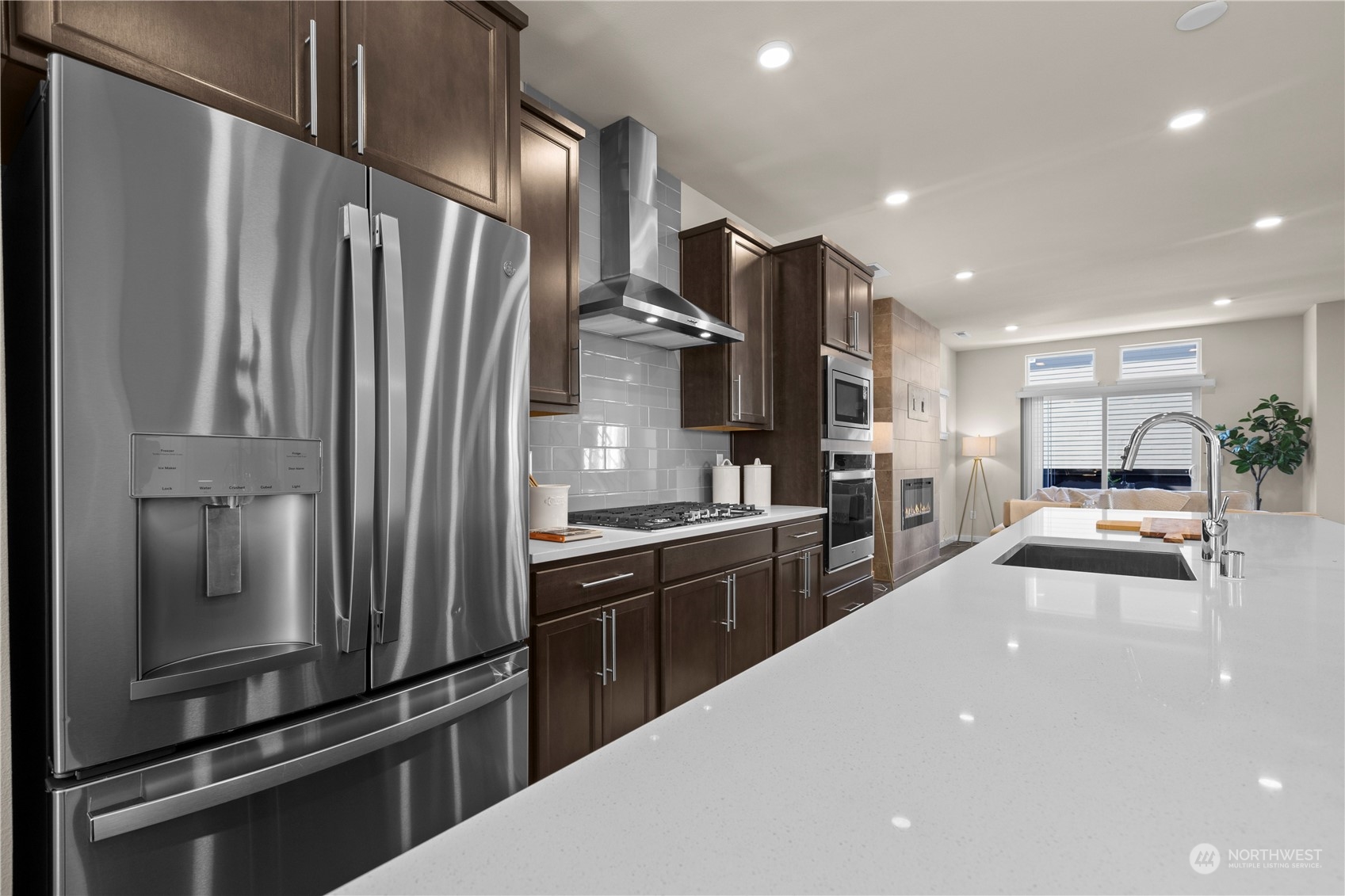 20803 3rd Drive Southeast Bothell, WA 98012 - Photo 9 of 30 a kitchen with stainless steel appliances a refrigerator and a stove top oven