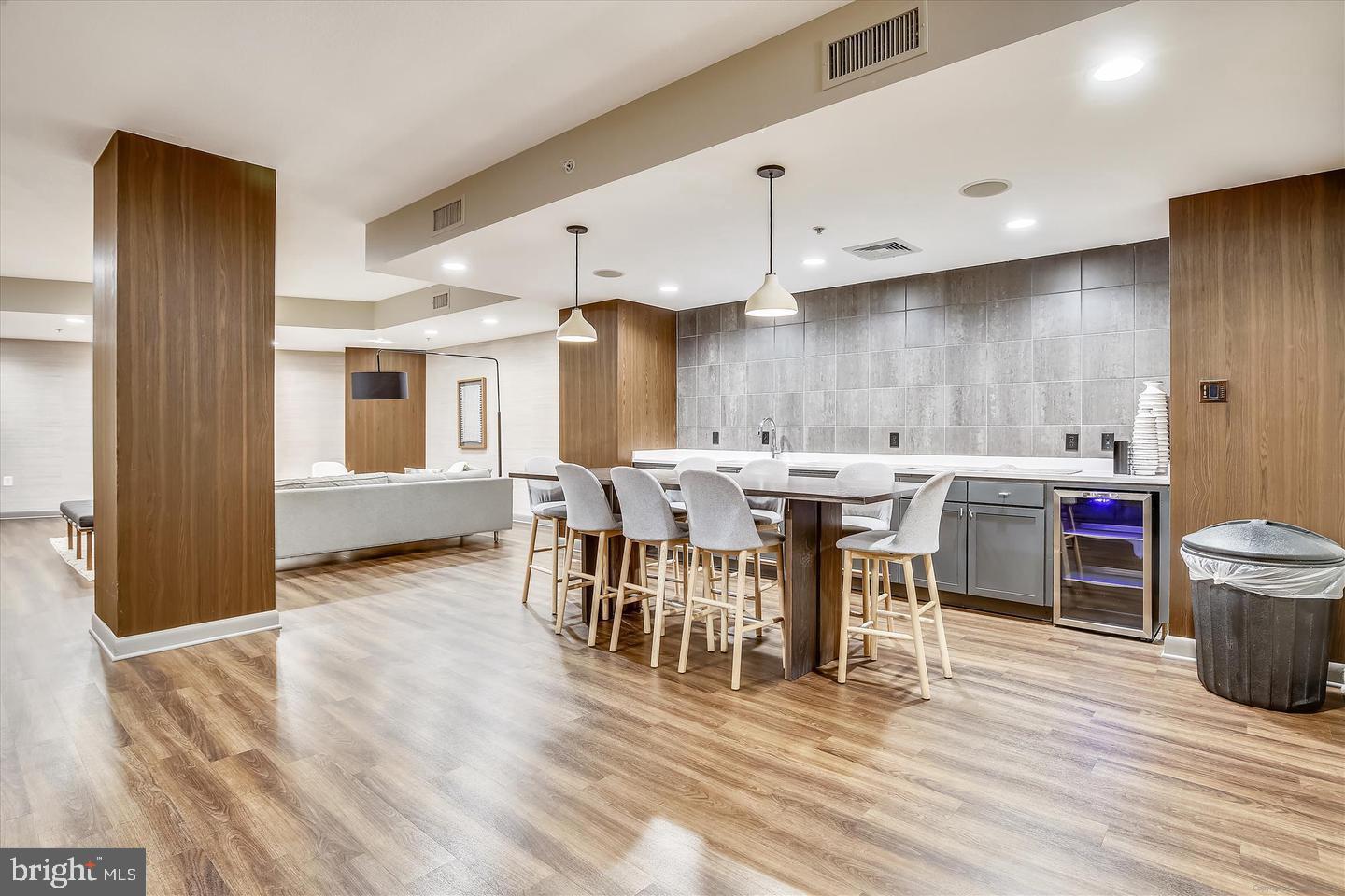 400 Massachusetts Avenue Northwest, Unit 1011 Washington, DC 20001 - Photo 23 of 31 a view of a dining room with furniture and wooden floor