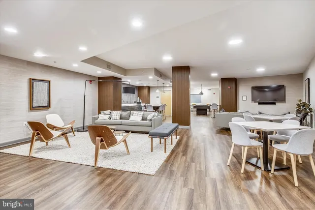 a kitchen with granite countertop a sink cabinets and stainless steel appliances