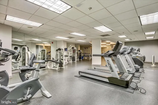 a roof deck with a table and chairs
