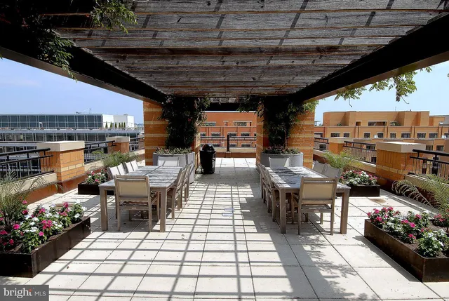 a view of a patio with table and chairs with wooden floor
