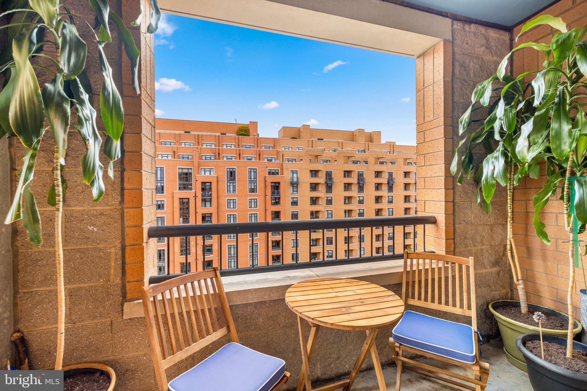 400 Massachusetts Avenue Northwest, Unit 1011 Washington, DC 20001 - Photo 5 of 31 a view of a chairs and table in the balcony