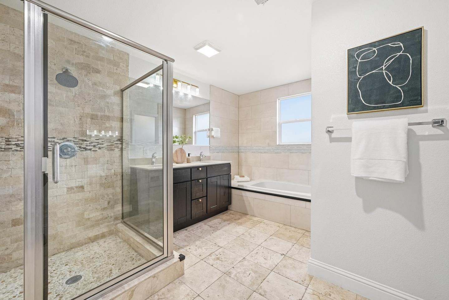 36045 Haley Street Newark, CA 94560 - Photo 21 of 38 a bathroom with a shower and a sink