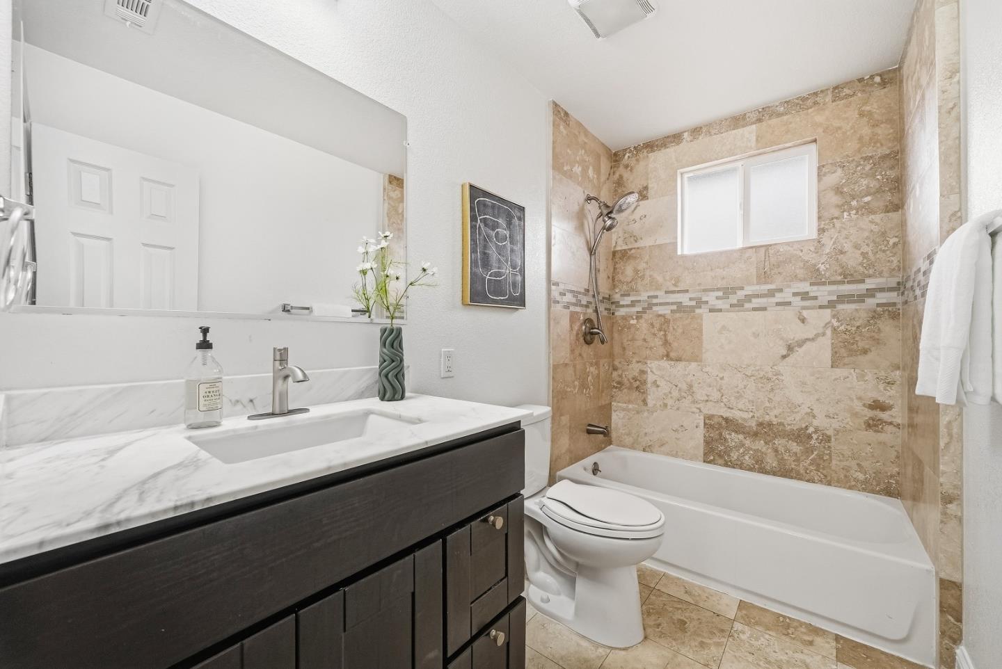 36045 Haley Street Newark, CA 94560 - Photo 22 of 38 a bathroom with a sink a toilet and shower