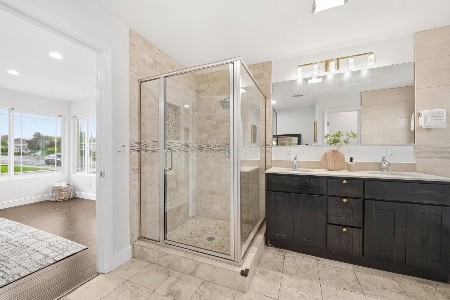 36045 Haley Street Newark, CA 94560 - Photo 23 of 38 a bathroom with a shower sink and mirror