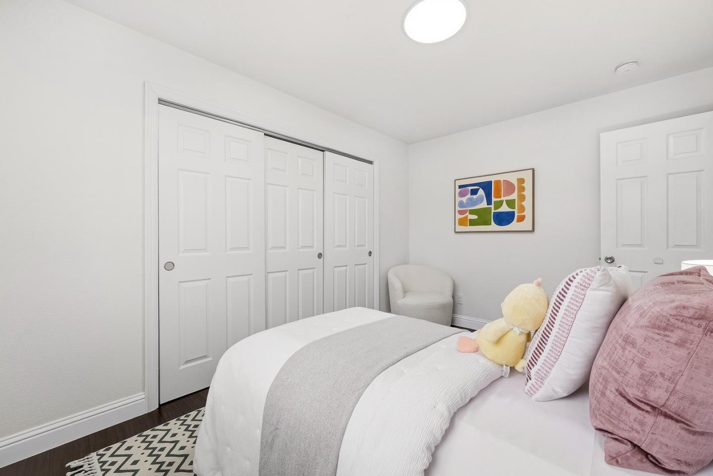 36045 Haley Street Newark, CA 94560 - Photo 25 of 38 a bedroom with a bed and painting on the wall