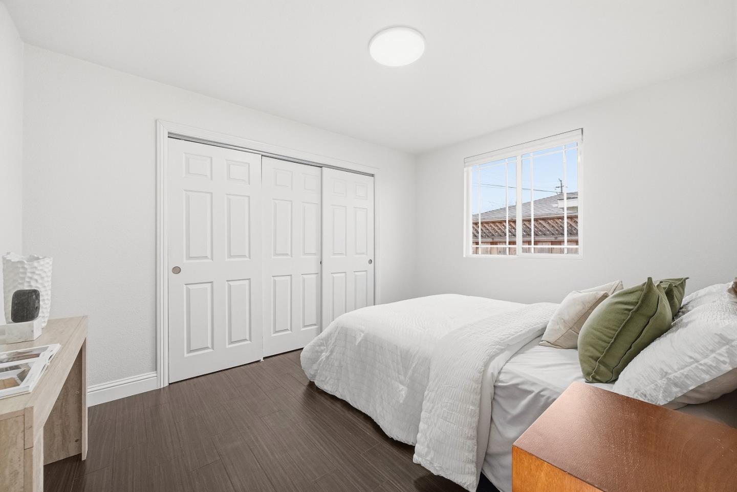 36045 Haley Street Newark, CA 94560 - Photo 27 of 38 a bedroom with a bed and a window