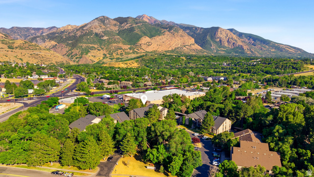 1175 Canyon Road, Unit 86 Ogden, UT 84404 - Photo 28 of 29 Aerial perspective showcasing a residential area nestled at the base of extensive mountain ranges
