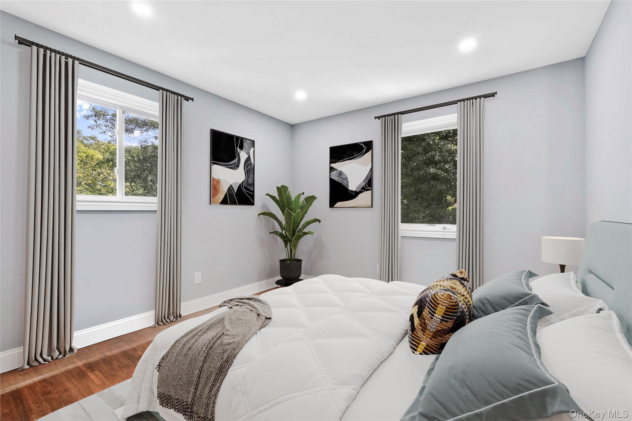 45 Forest Drive Centerport, NY 11721 - Photo 25 of 41 a bedroom with a large bed and a window