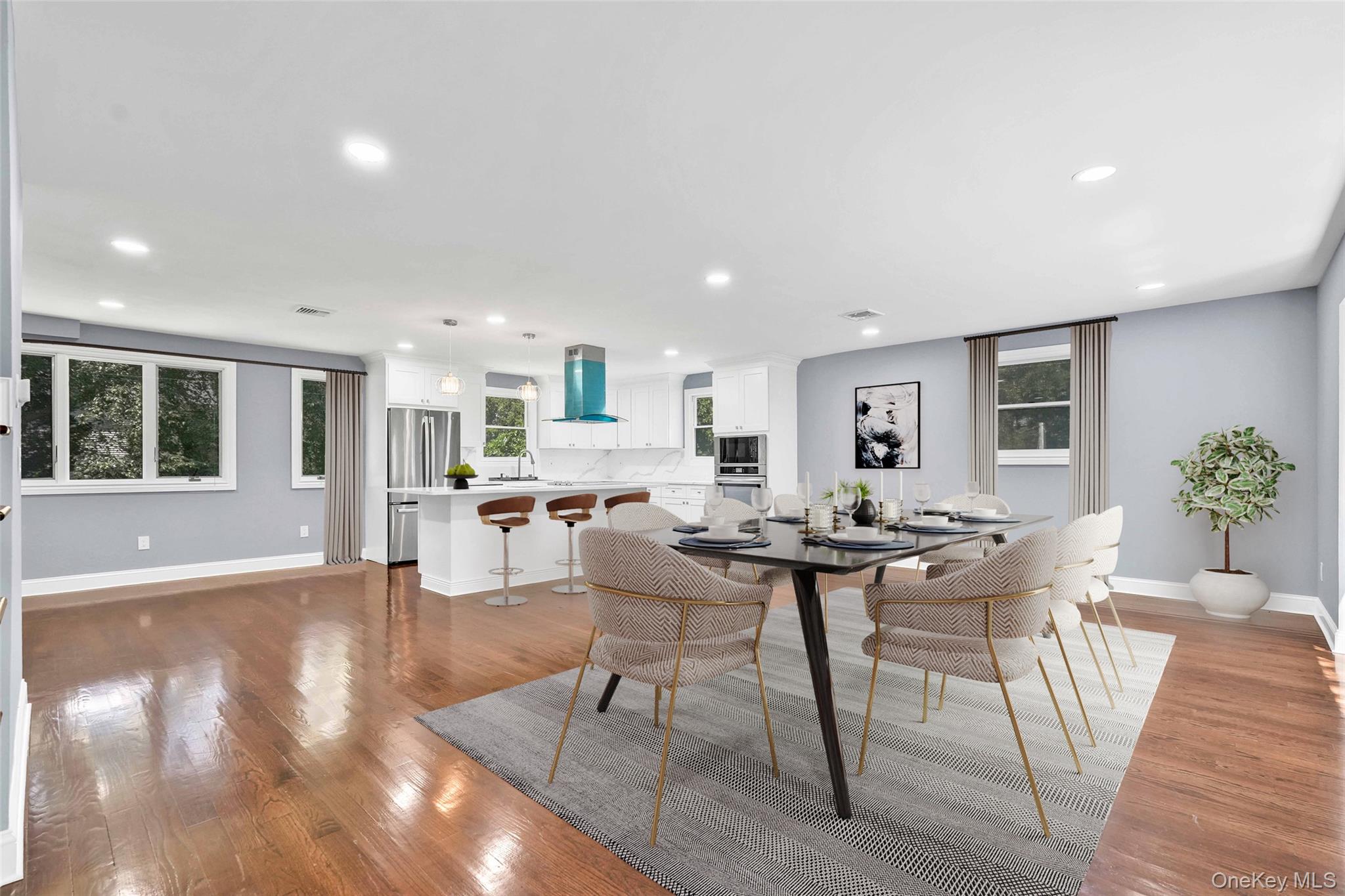 45 Forest Drive Centerport, NY 11721 - Photo 4 of 41 a view of a dining room with furniture and wooden floor