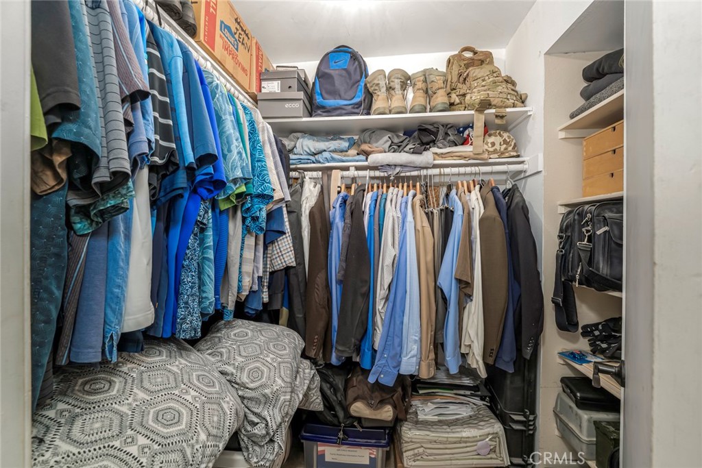 25712 Le Parc, Unit 48 Lake Forest, CA 92630 - Photo 19 of 30 a view of walk in closet with clothes