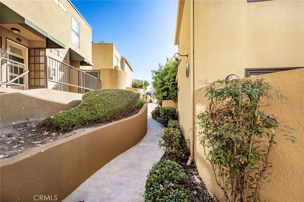 25712 Le Parc, Unit 48 Lake Forest, CA 92630 - Photo 25 of 30 a view of a house with a yard