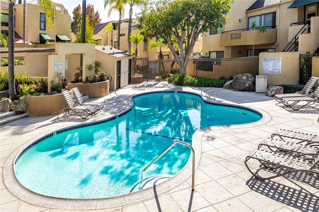 25712 Le Parc, Unit 48 Lake Forest, CA 92630 - Photo 29 of 30 a view of a swimming pool with a patio