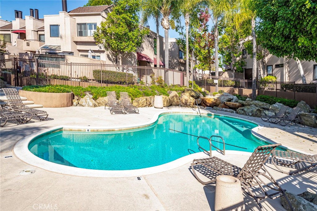 25712 Le Parc, Unit 48 Lake Forest, CA 92630 - Photo 30 of 30 a view of a swimming pool with a patio
