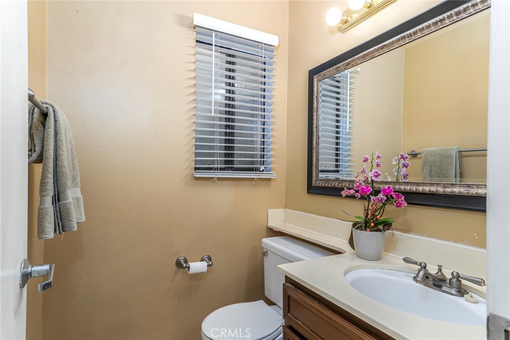 25712 Le Parc, Unit 48 Lake Forest, CA 92630 - Photo 5 of 30 a bathroom with a sink toilet and mirror
