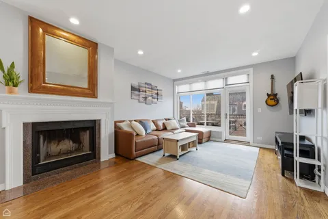 a kitchen with stainless steel appliances granite countertop a refrigerator stove microwave and sink