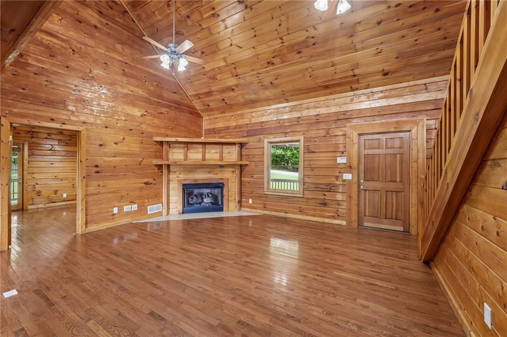 1384 Crystal Lane Northeast Ranger, GA 30734 - Photo 10 of 89 a view of a livingroom with wooden floor and a fireplace