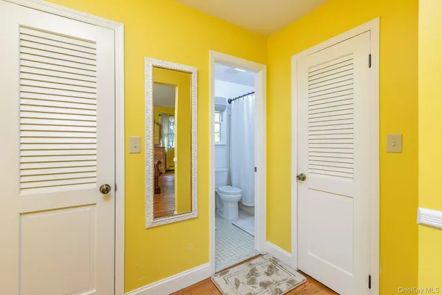 a bathroom with a glass door shower and a sink