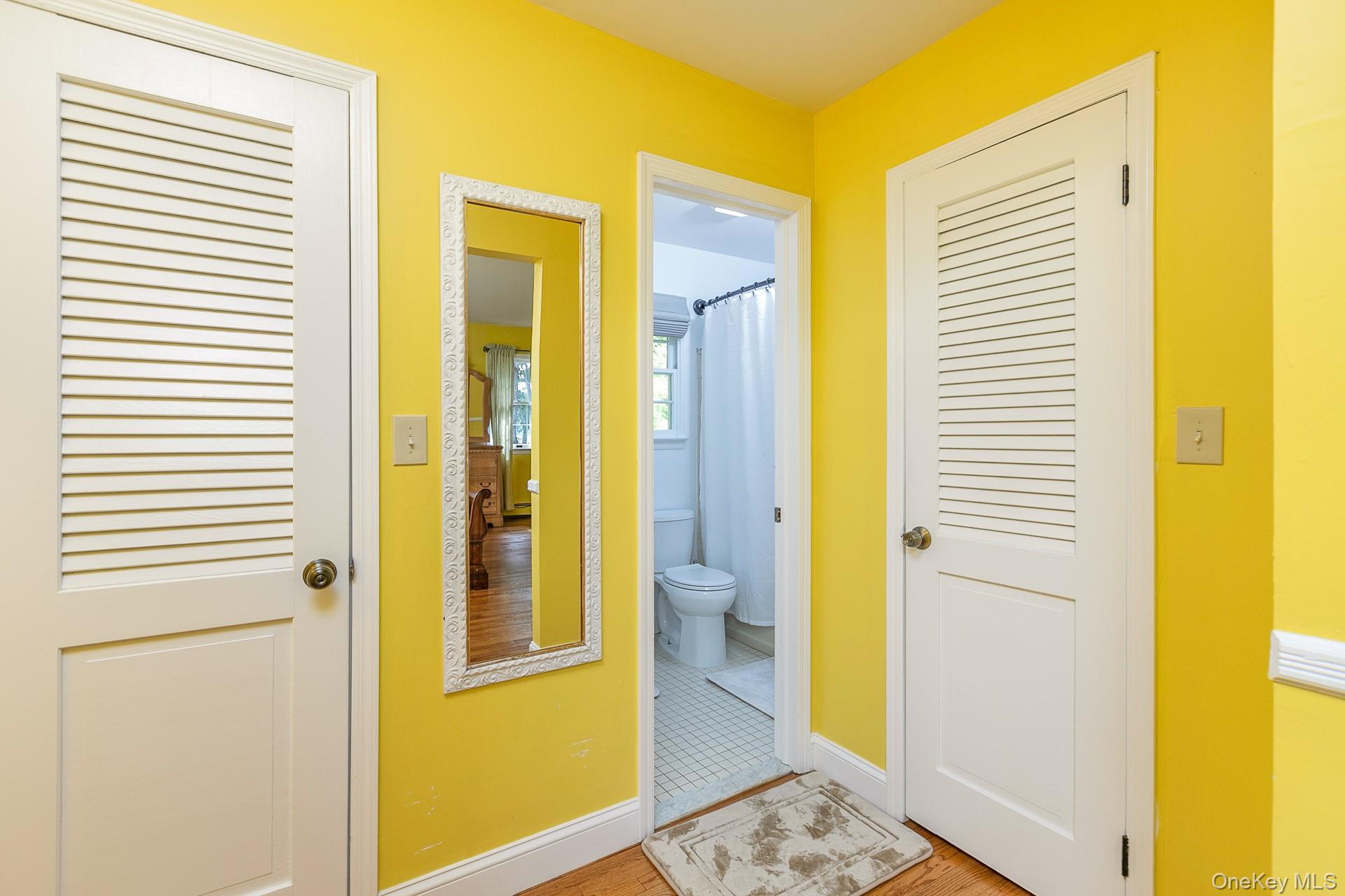 451 River Road St. James, NY 11780 - Photo 16 of 26 a bathroom with a glass door shower and a sink