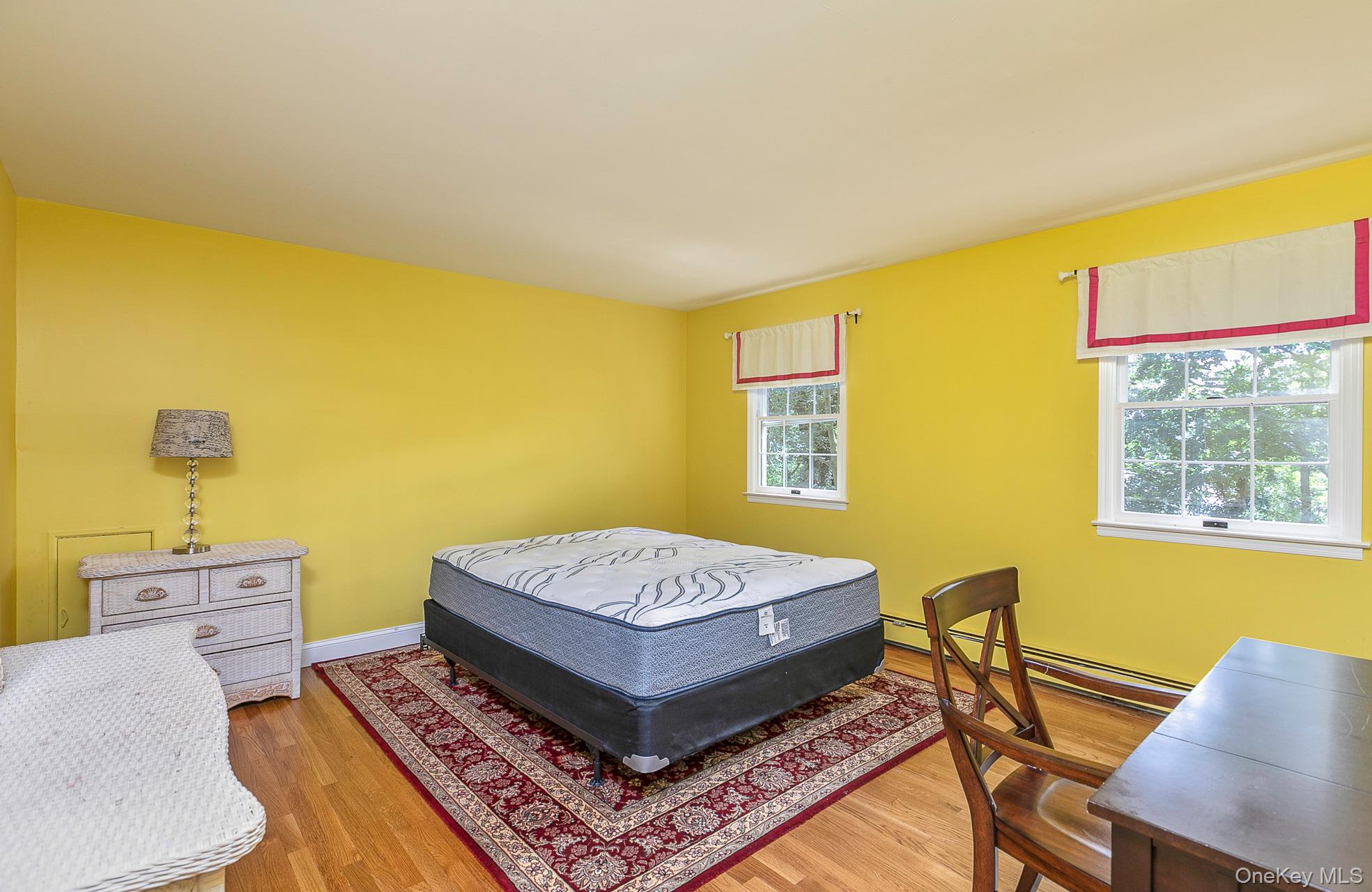 451 River Road St. James, NY 11780 - Photo 21 of 26 a living room with a table and a couch