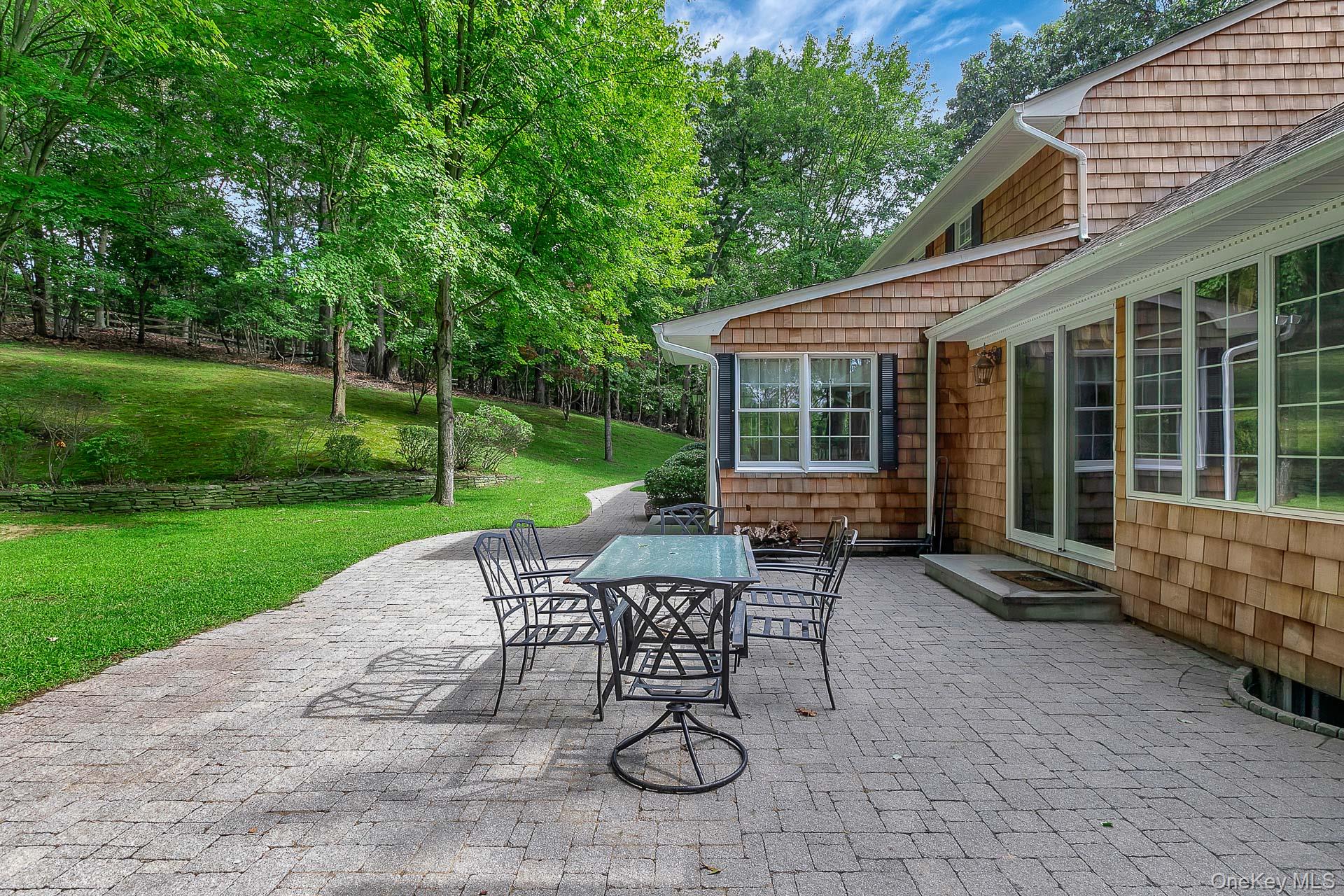 451 River Road St. James, NY 11780 - Photo 26 of 26 a view of a house with backyard and a sitting area