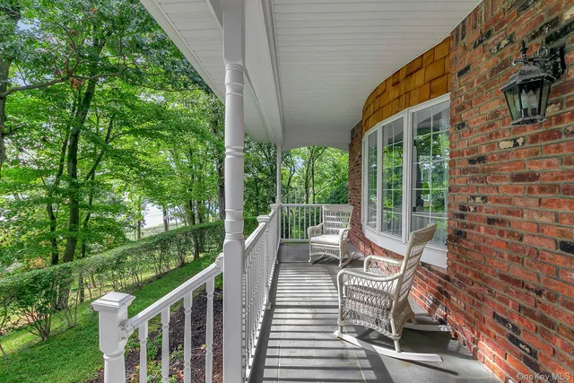 a view of a chair and table in the balcony