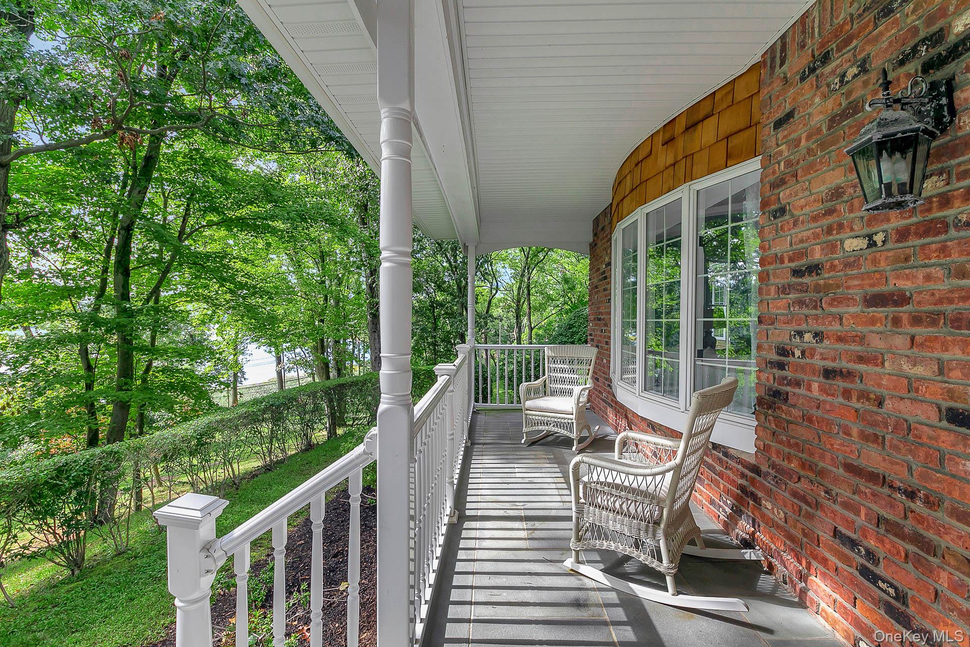 451 River Road St. James, NY 11780 - Photo 4 of 26 a view of a chair and table in the balcony