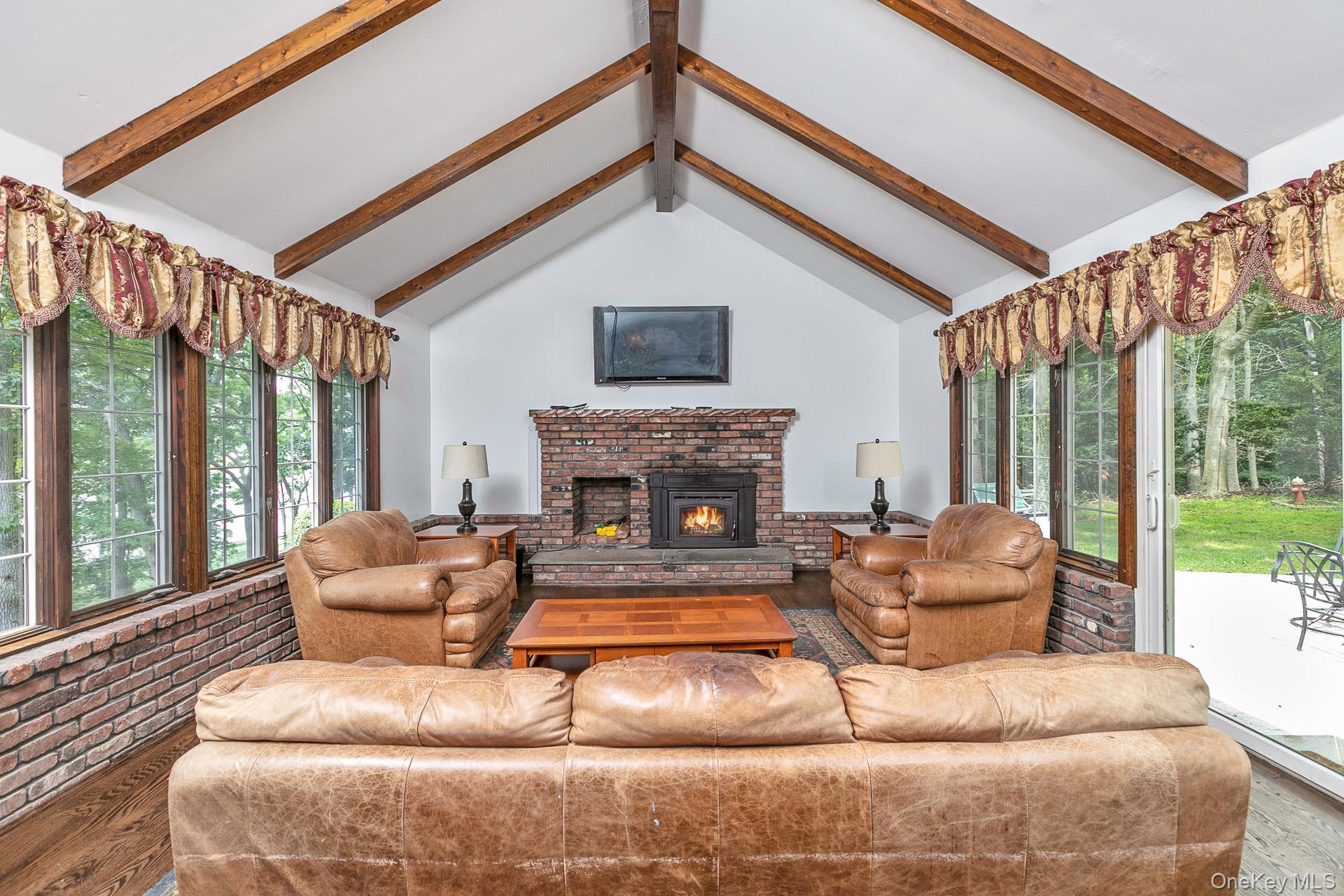 451 River Road St. James, NY 11780 - Photo 10 of 26 a living room with furniture and a fireplace