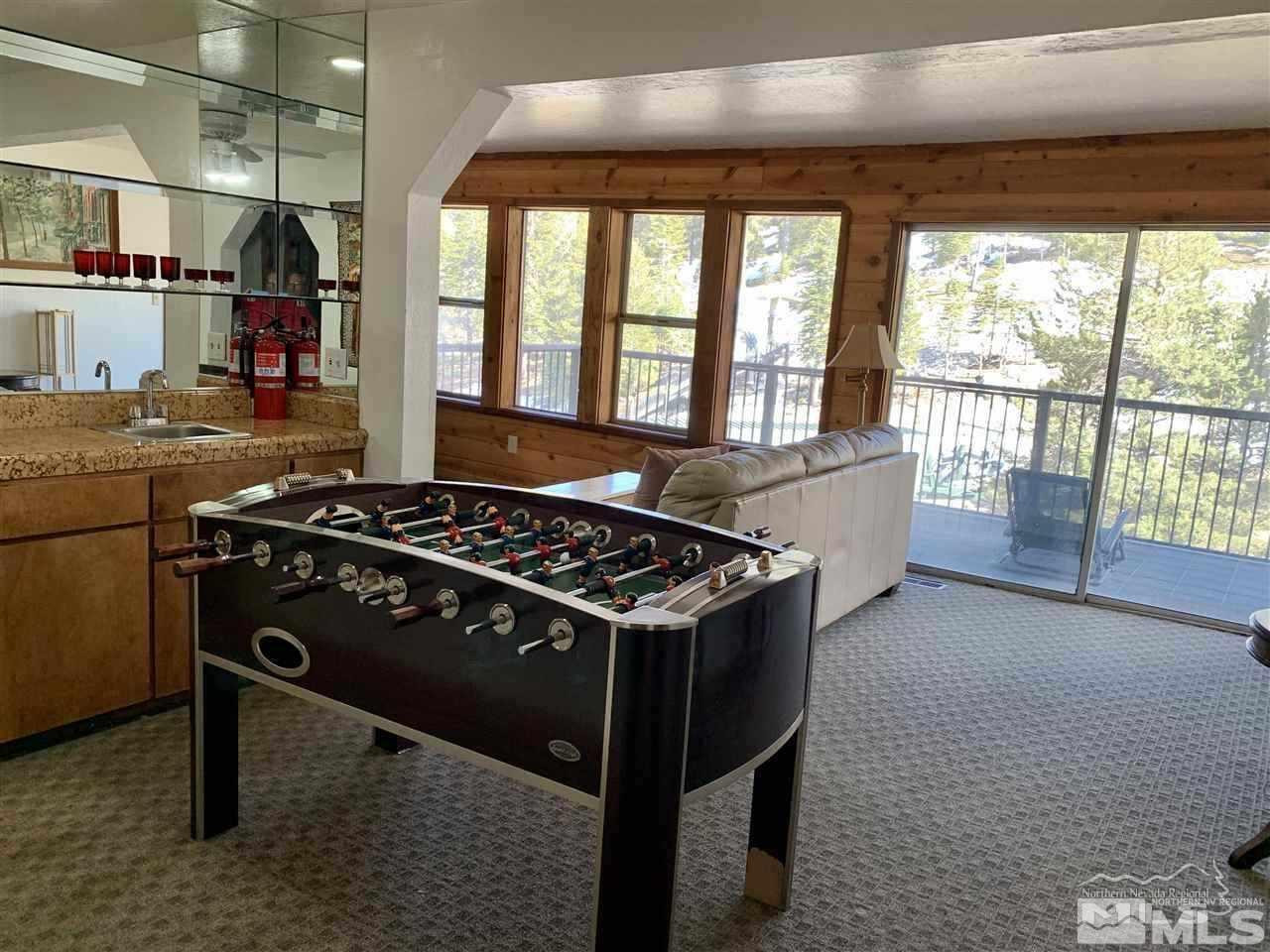 424 Quaking Aspen Lane, Unit B Stateline, NV 89449 - Photo 16 of 30 a kitchen with a stove and a wooden floor