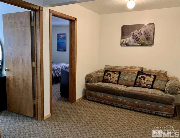 a living room with a couch and a stove