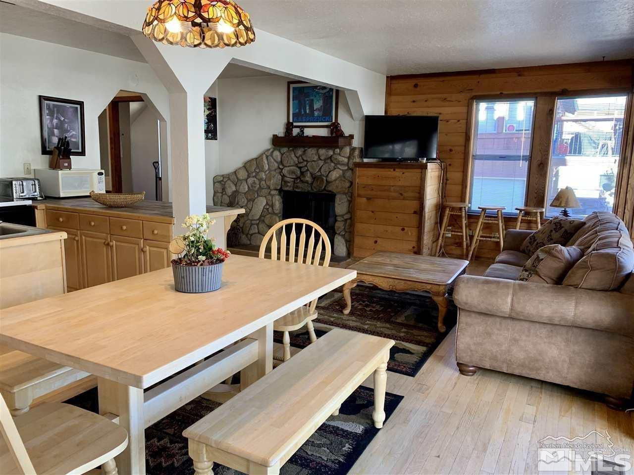 424 Quaking Aspen Lane, Unit B Stateline, NV 89449 - Photo 2 of 30 a living room with furniture and a fireplace