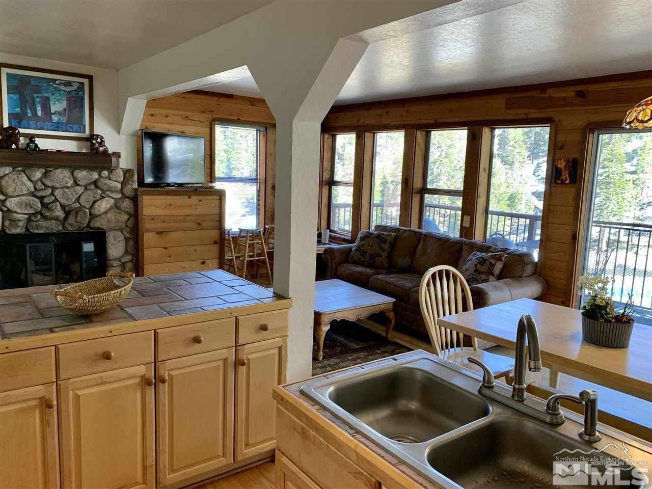 424 Quaking Aspen Lane, Unit B Stateline, NV 89449 - Photo 10 of 30 a kitchen with a sink and a stove next to a window