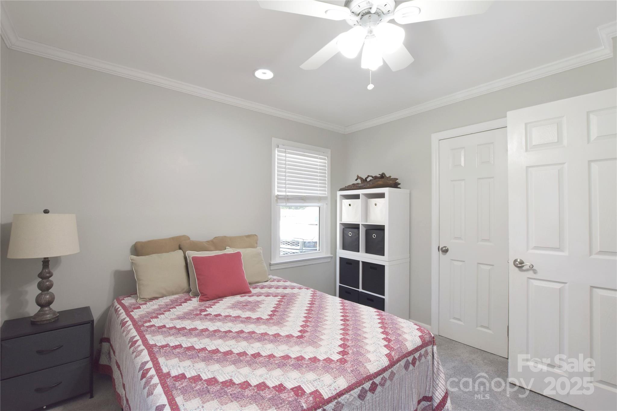111 Berry Street Chester, SC 29706 - Photo 12 of 23 a bedroom with a bed and a chandelier