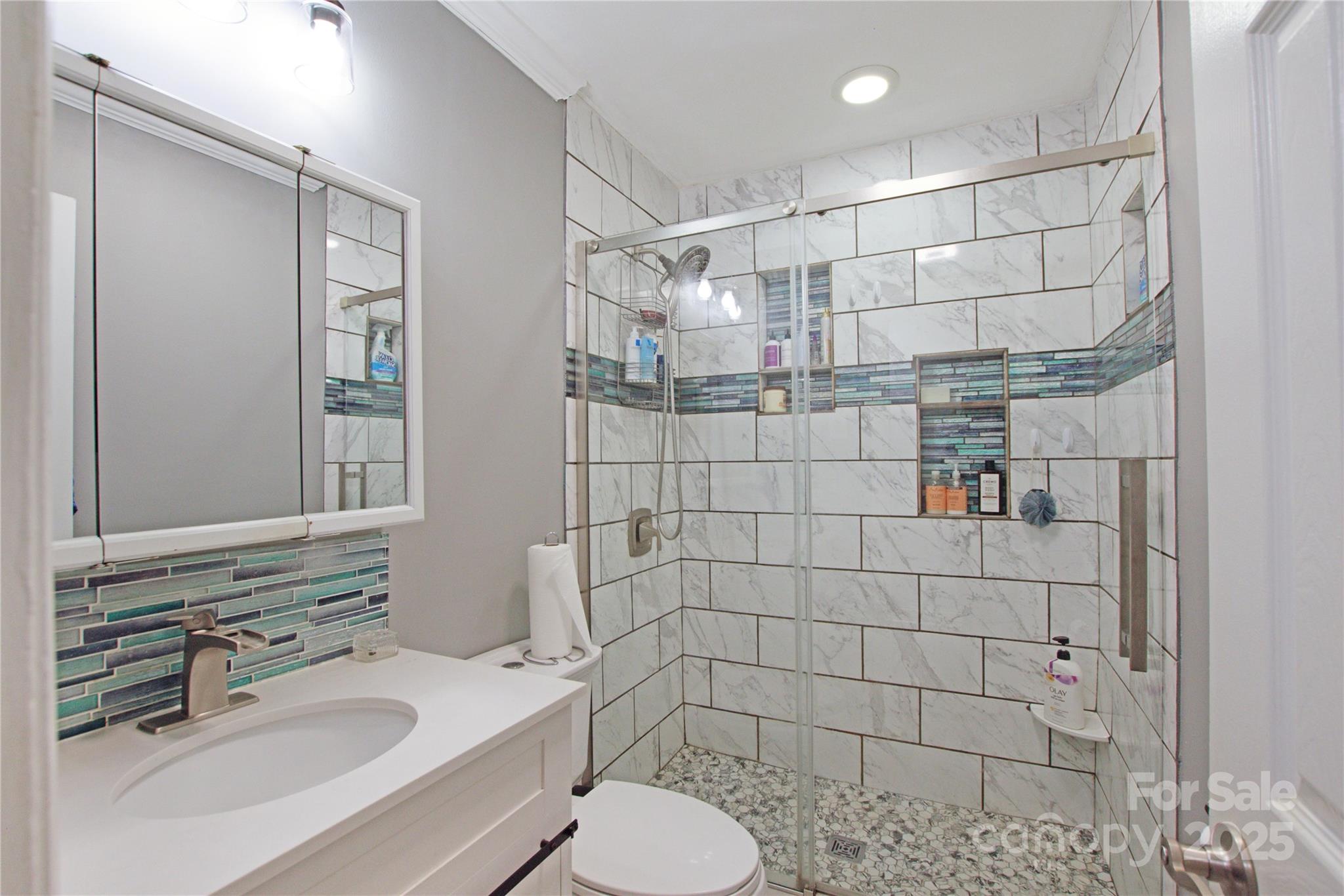 111 Berry Street Chester, SC 29706 - Photo 16 of 23 a bathroom with a sink toilet and shower