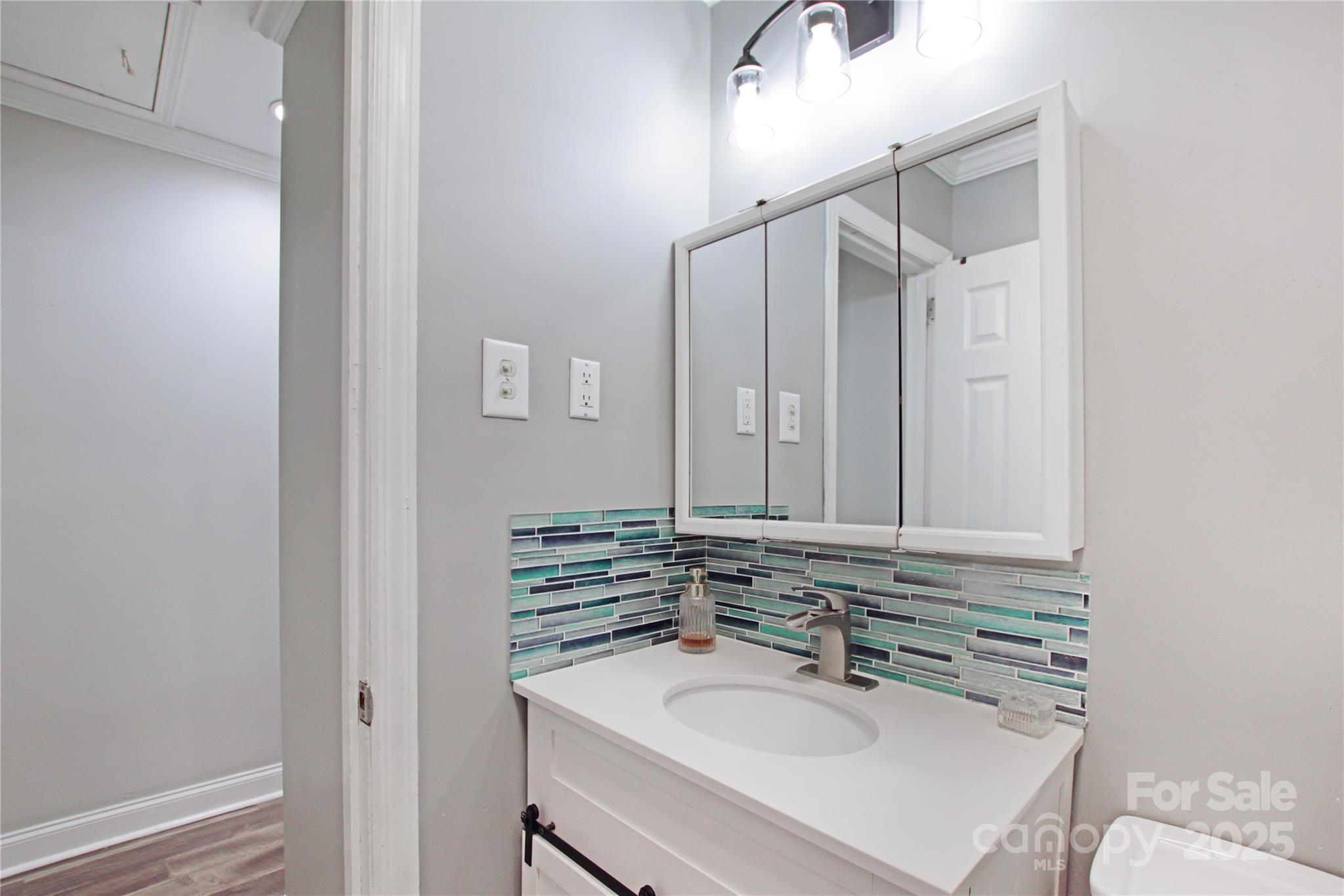 111 Berry Street Chester, SC 29706 - Photo 17 of 23 a bathroom with a sink and a mirror
