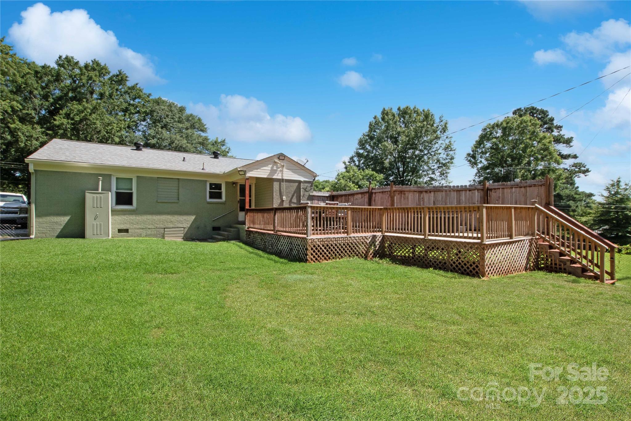 111 Berry Street Chester, SC 29706 - Photo 23 of 23 a view of a backyard with potted plants and large tree