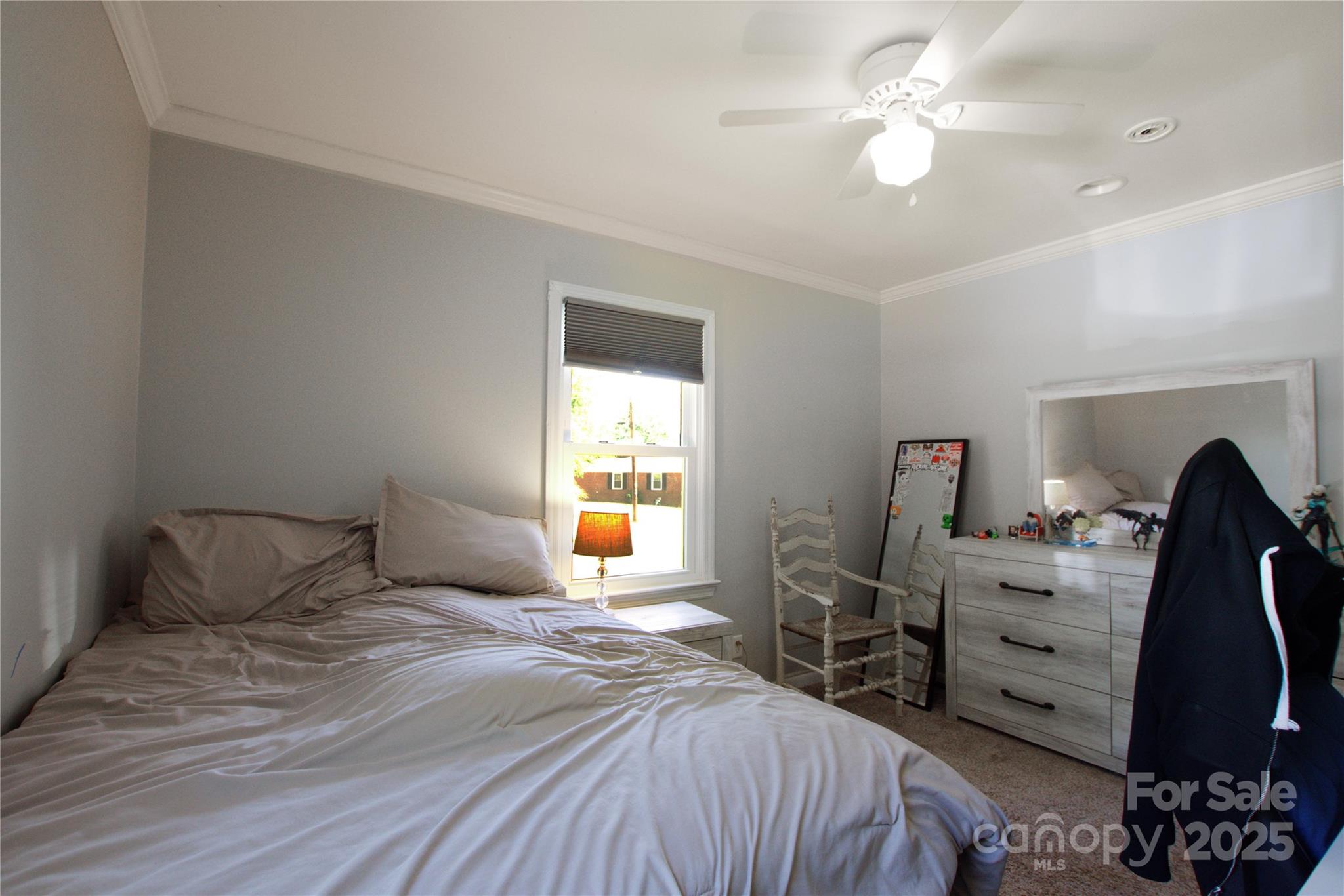 111 Berry Street Chester, SC 29706 - Photo 10 of 23 a bedroom with a bed and a chandelier