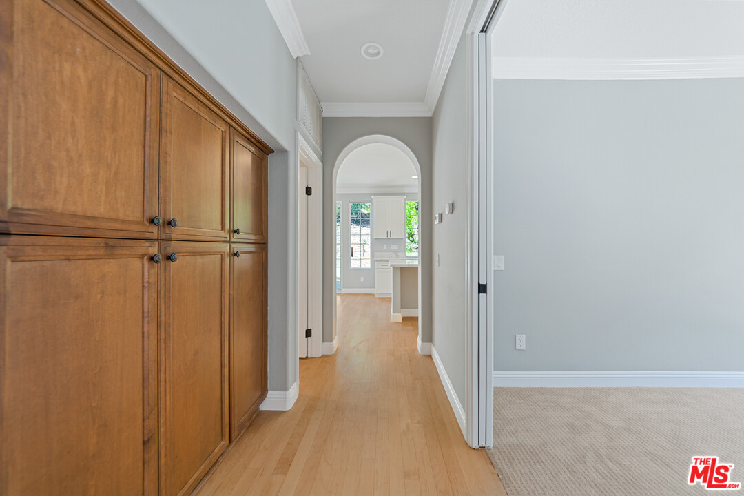 149 Laurel Ridge Drive Simi Valley, CA 93065 - Photo 13 of 53 a view of a hallway with wooden floor and a cabinet