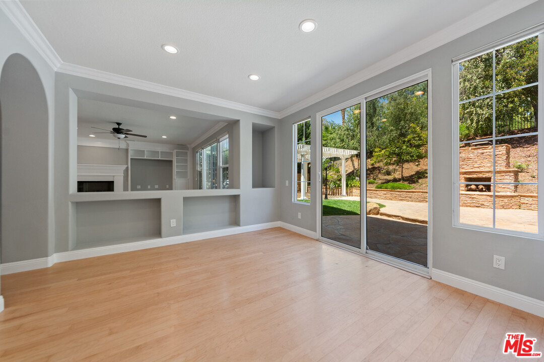 149 Laurel Ridge Drive Simi Valley, CA 93065 - Photo 18 of 53 a view of an empty room with a window and wooden floor
