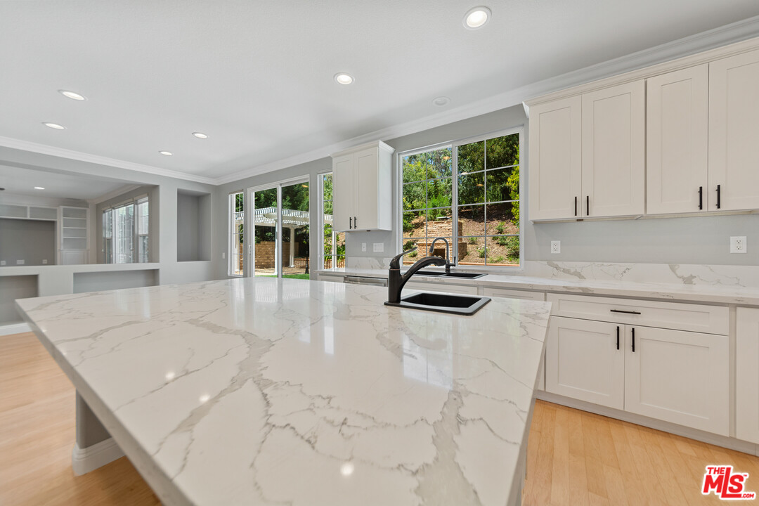 149 Laurel Ridge Drive Simi Valley, CA 93065 - Photo 23 of 53 a kitchen with sink refrigerator and cabinets